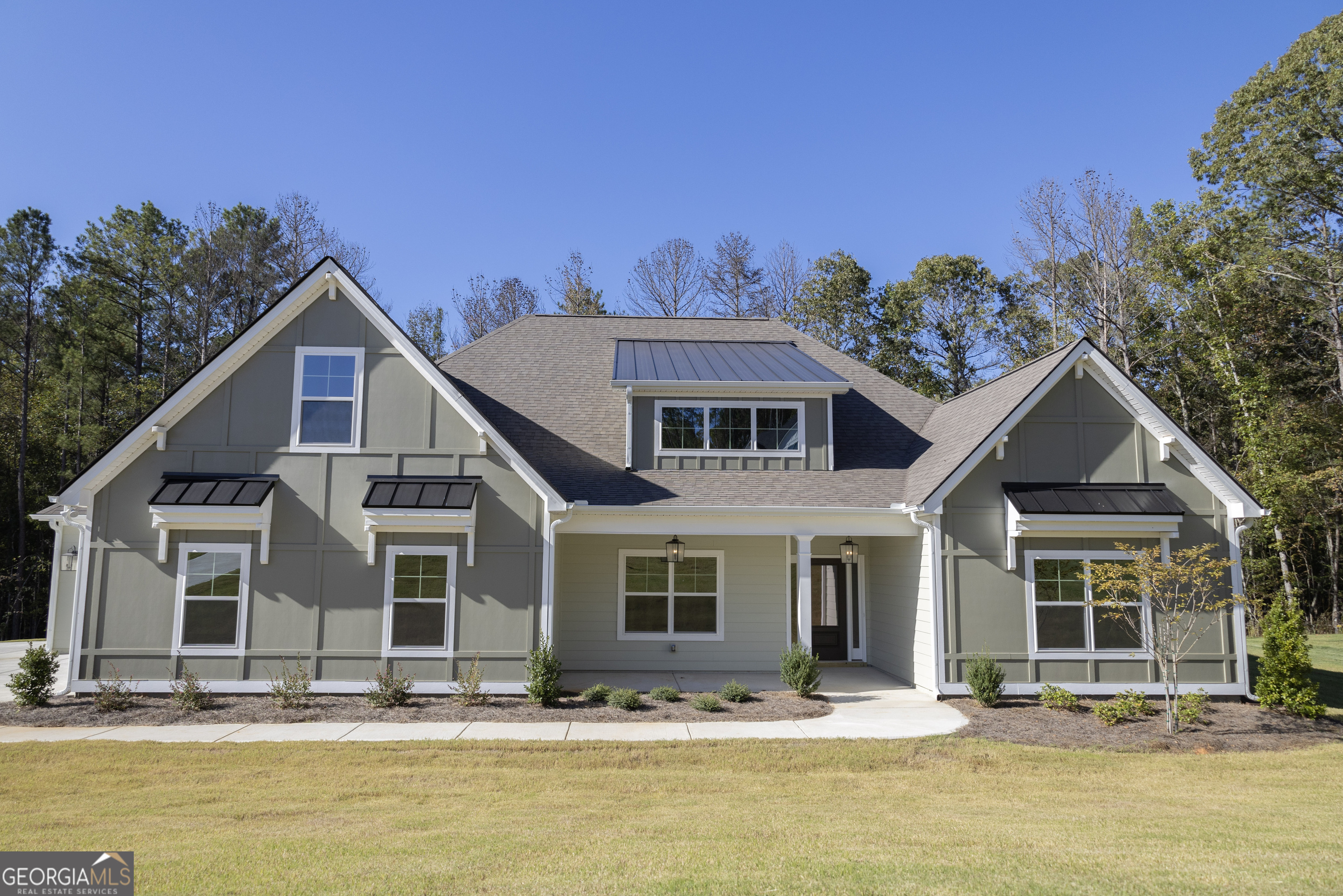 a front view of a house with a yard