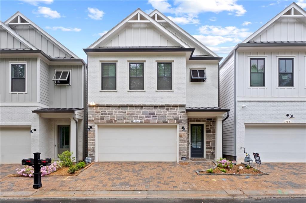 a front view of a house with garage