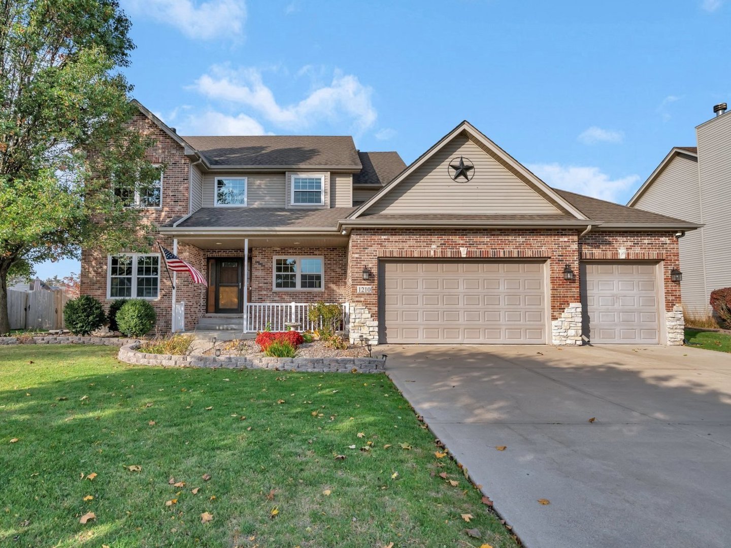 front view of a house with a yard