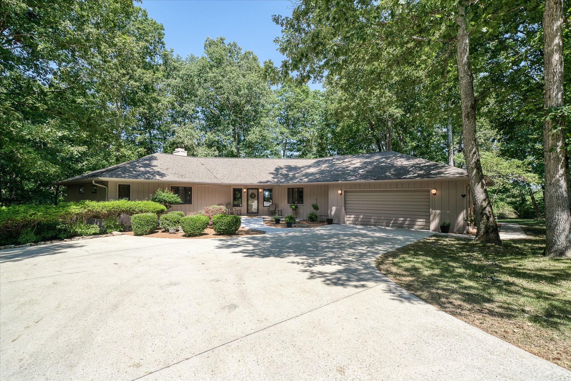 a view of a house with a tree in the background