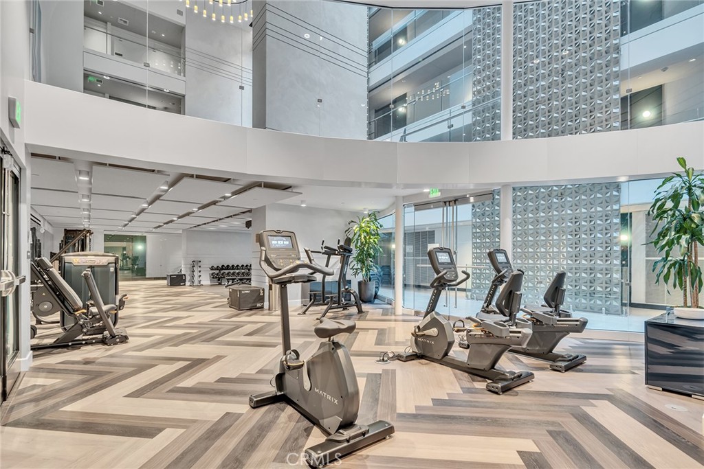 a view of a gym with a table and chairs