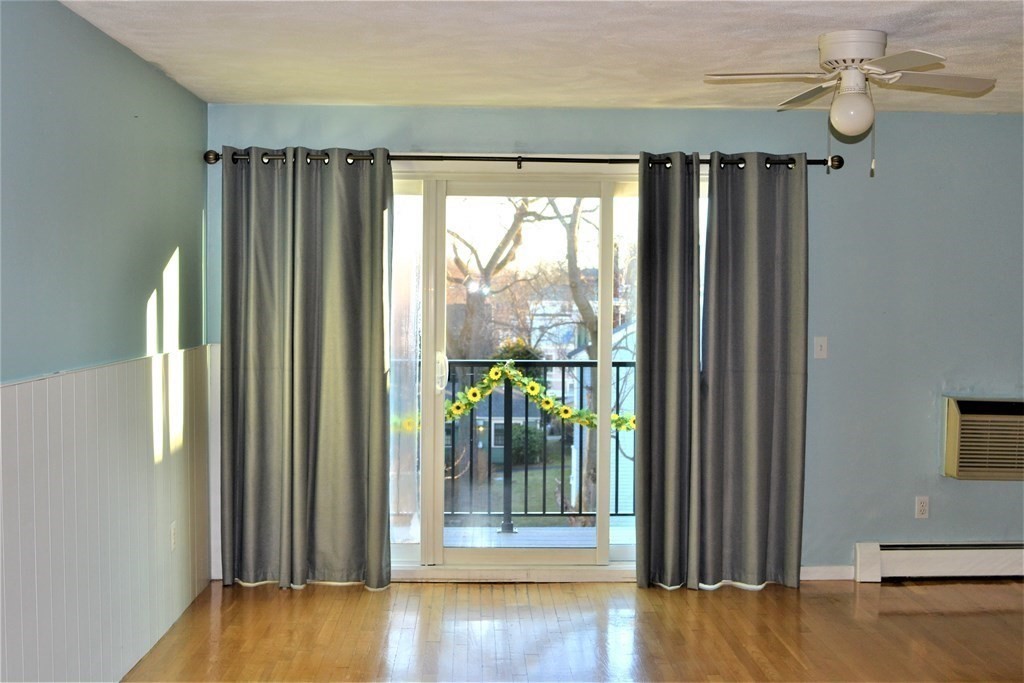 a view of entryway with wooden floor