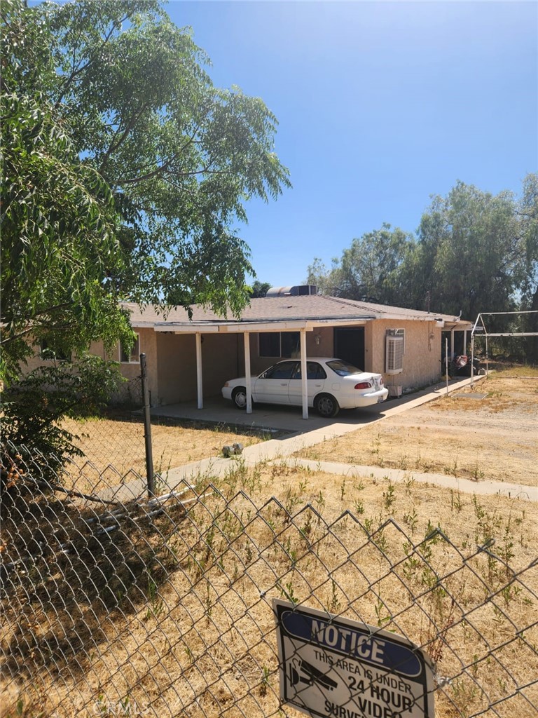 a house view with a backyard space