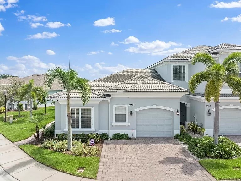 front view of a house with a yard