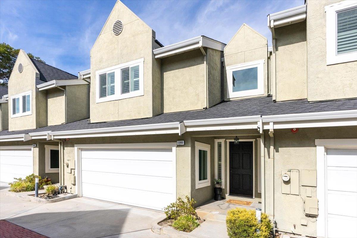 a front view of a house with a garage