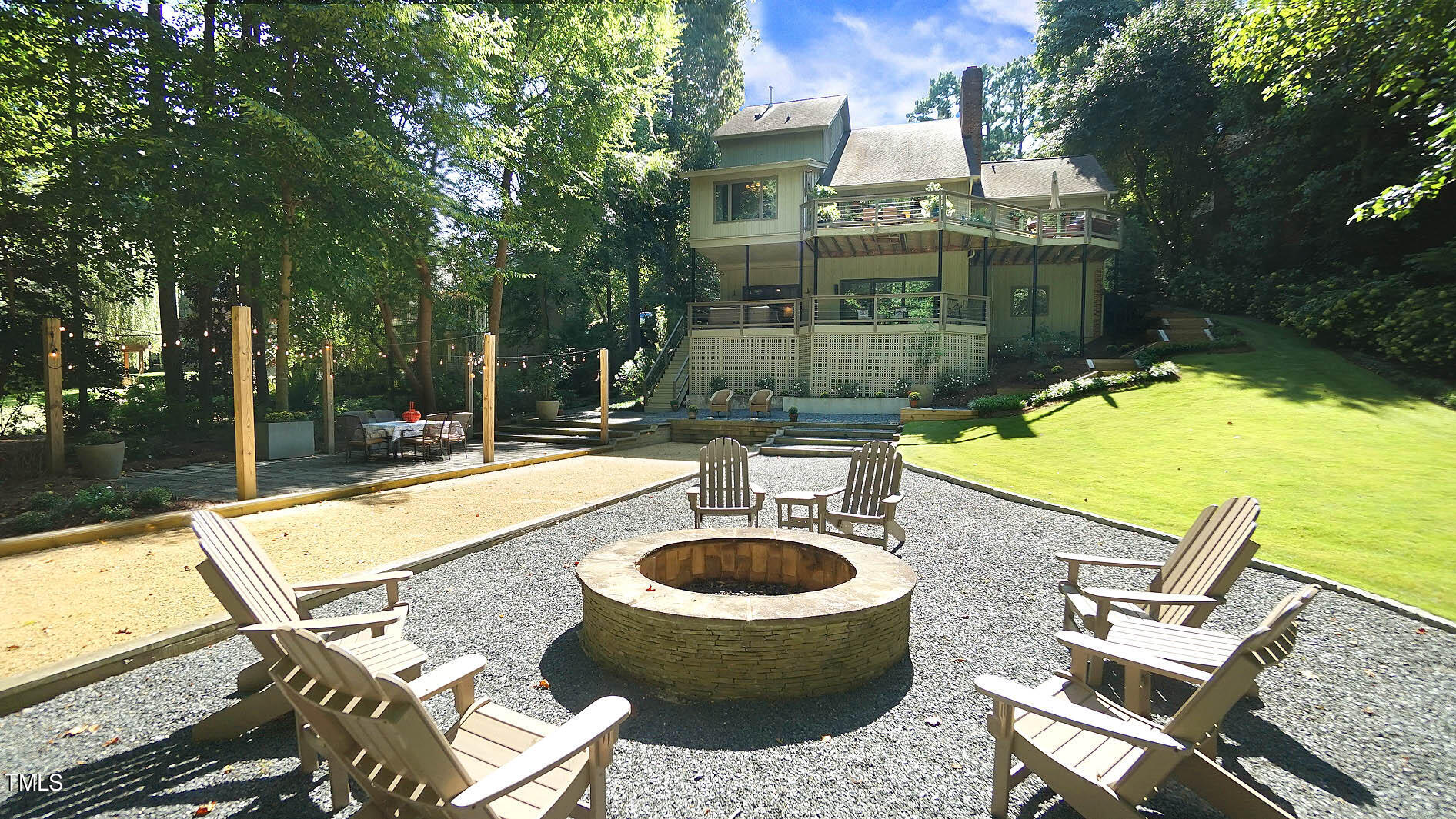 a view of a swimming pool with a patio and a yard