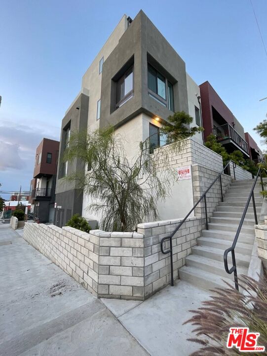 a view of a house with a street