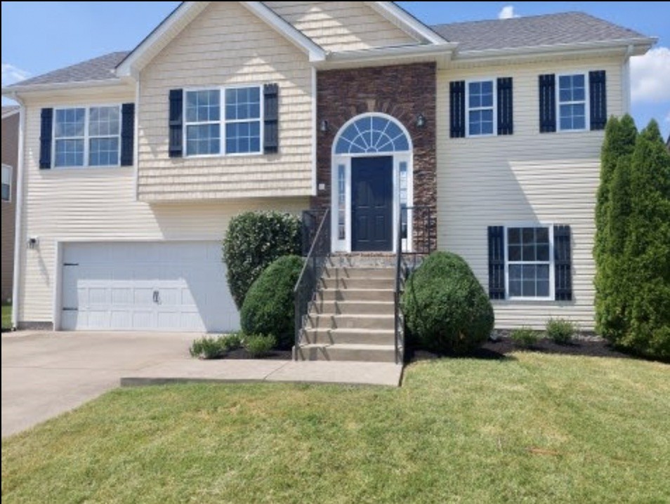 front view of a house with a yard