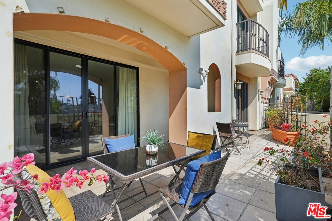 a outdoor space with lots of potted plants