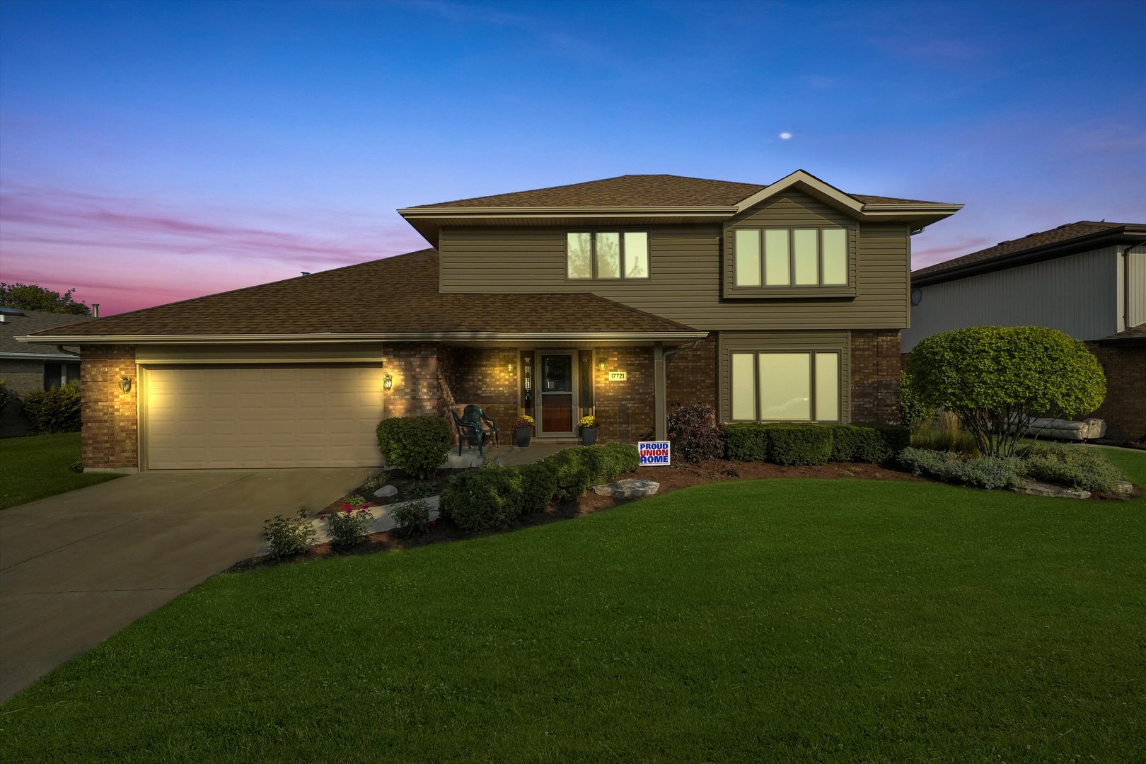 a front view of a house with garden