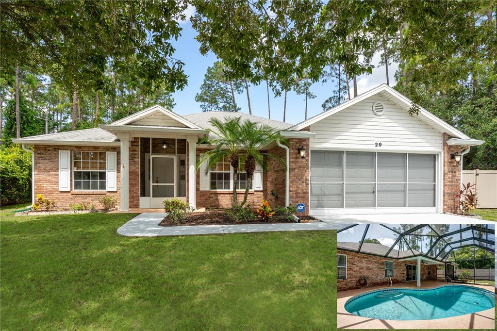 a front view of a house with a yard garden and outdoor seating