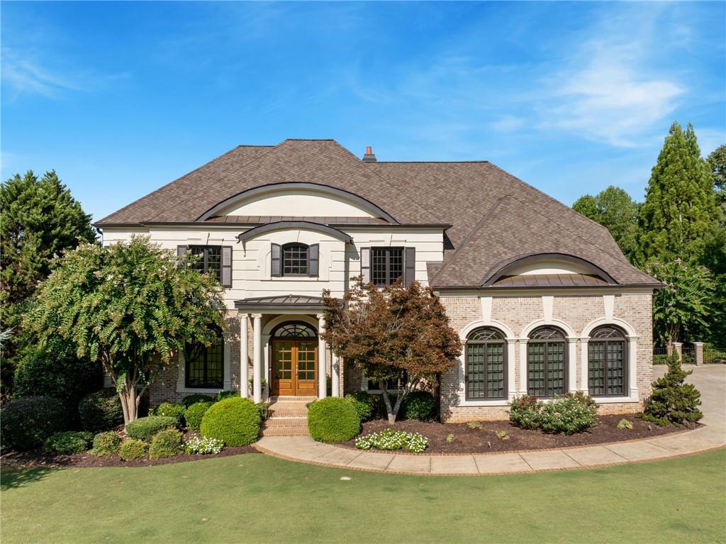 a front view of a house with a yard