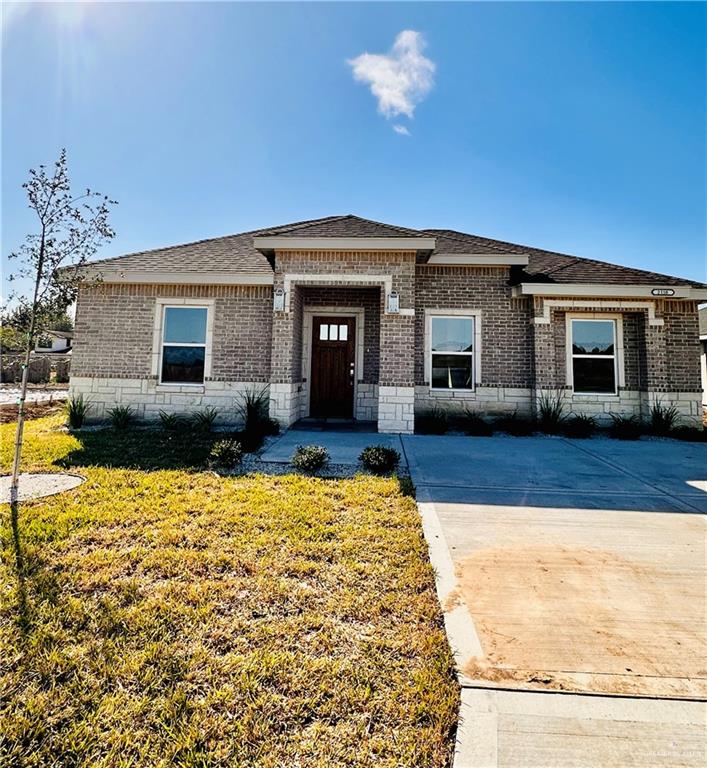 Prairie-style home with a front lawn