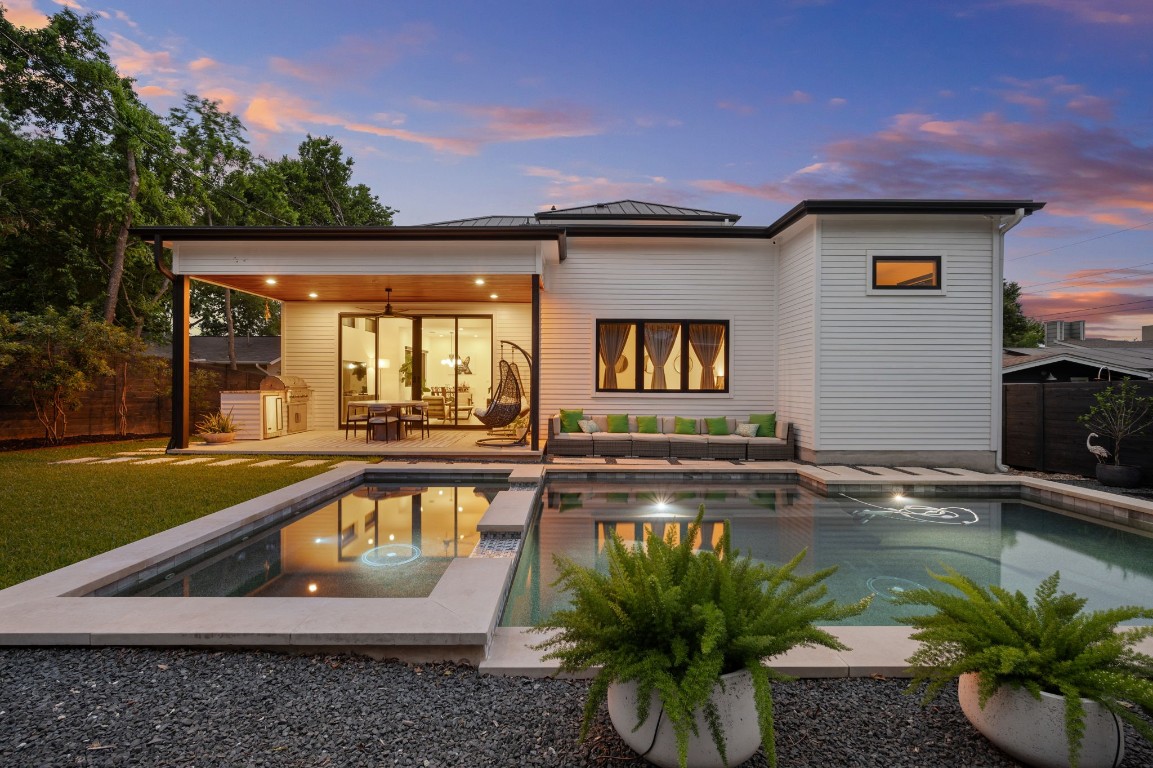 a view of a swimming pool with a patio