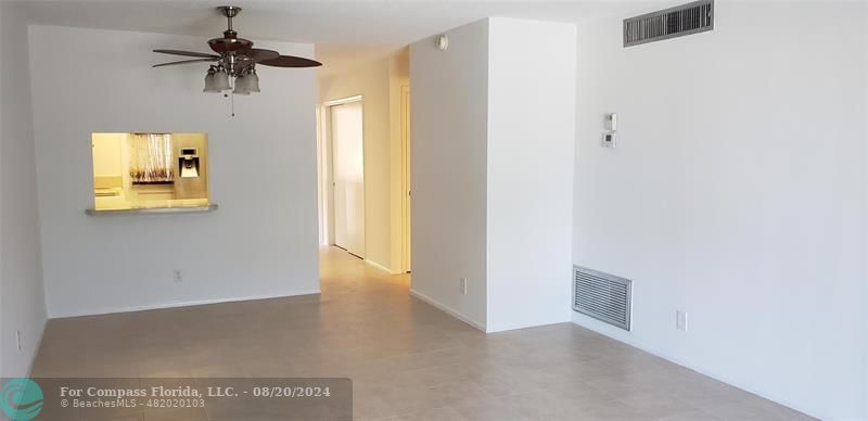 a view of a hallway with a window