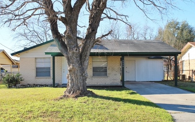 a front view of house having yard