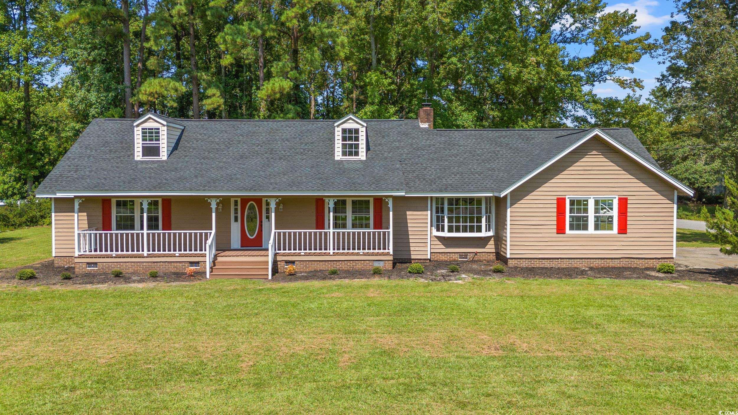 View of front of property featuring a porch and a