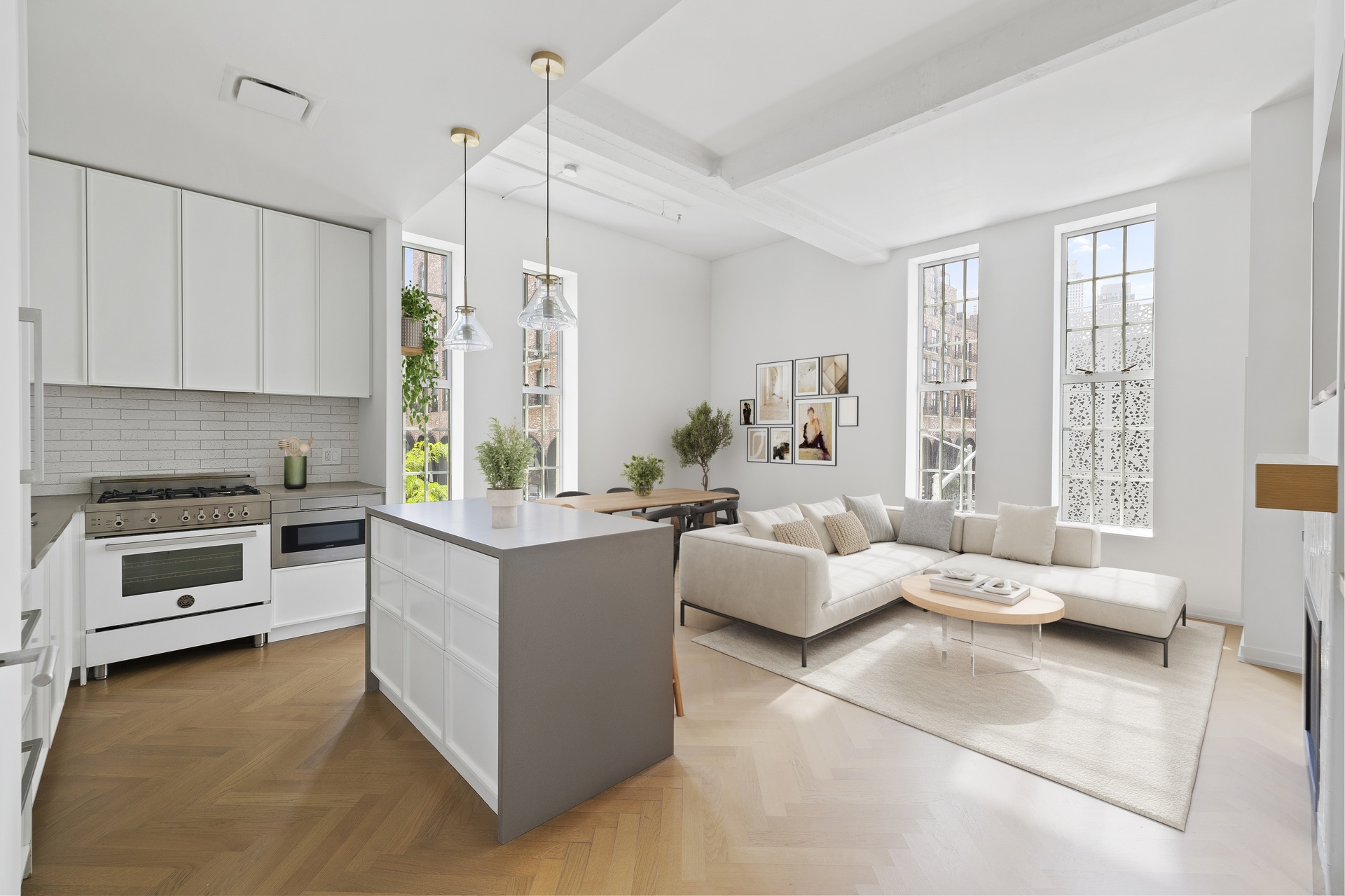 a kitchen with stainless steel appliances kitchen island granite countertop a stove and white cabinets