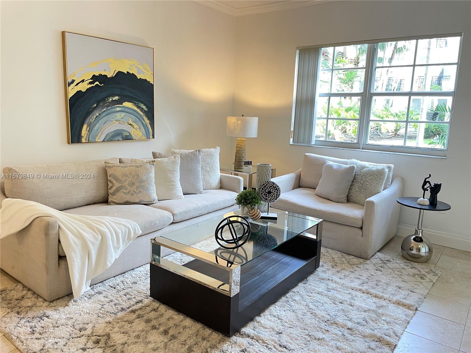 a living room with furniture and a window