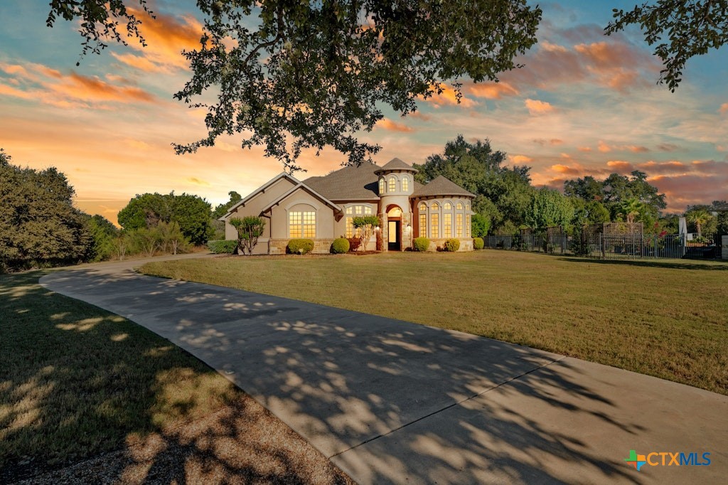 a view of a house with a yard