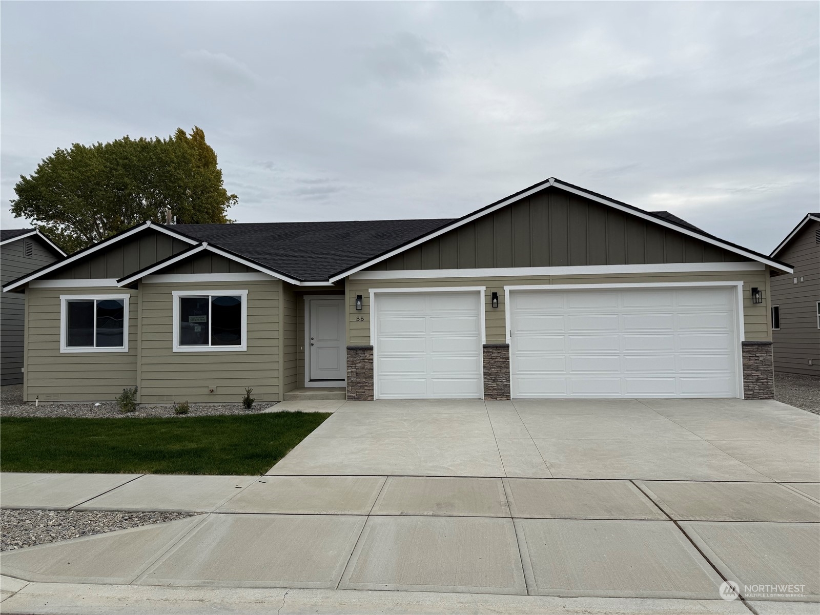 a front view of a house with garage