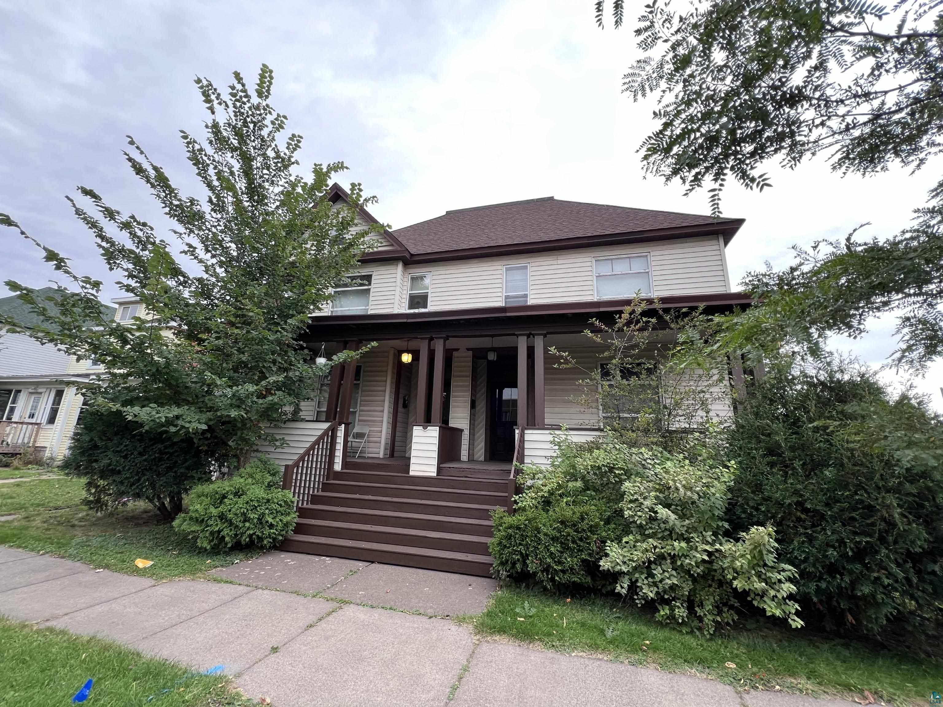 View of front of property featuring covered porch