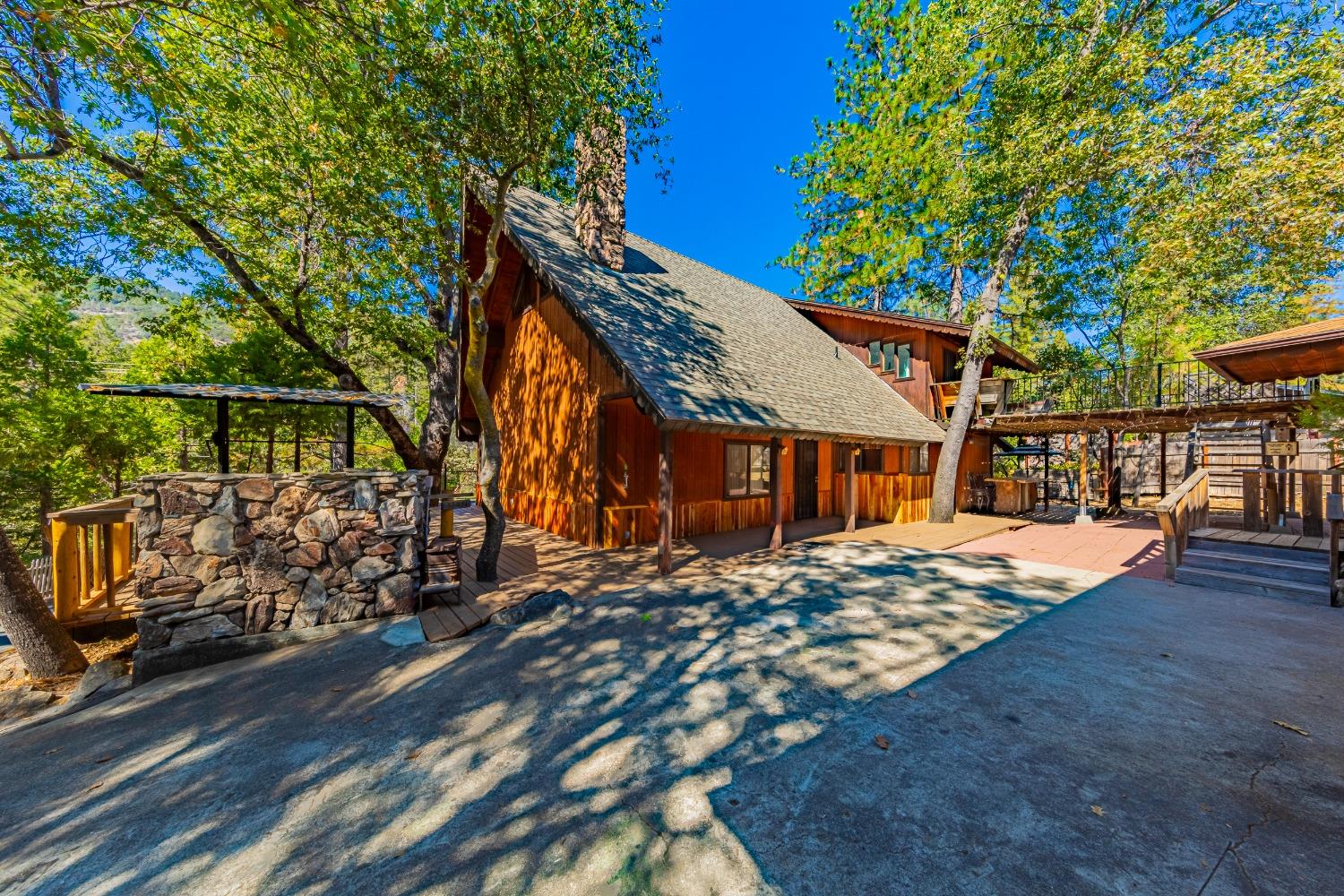 a view of a house with a large tree