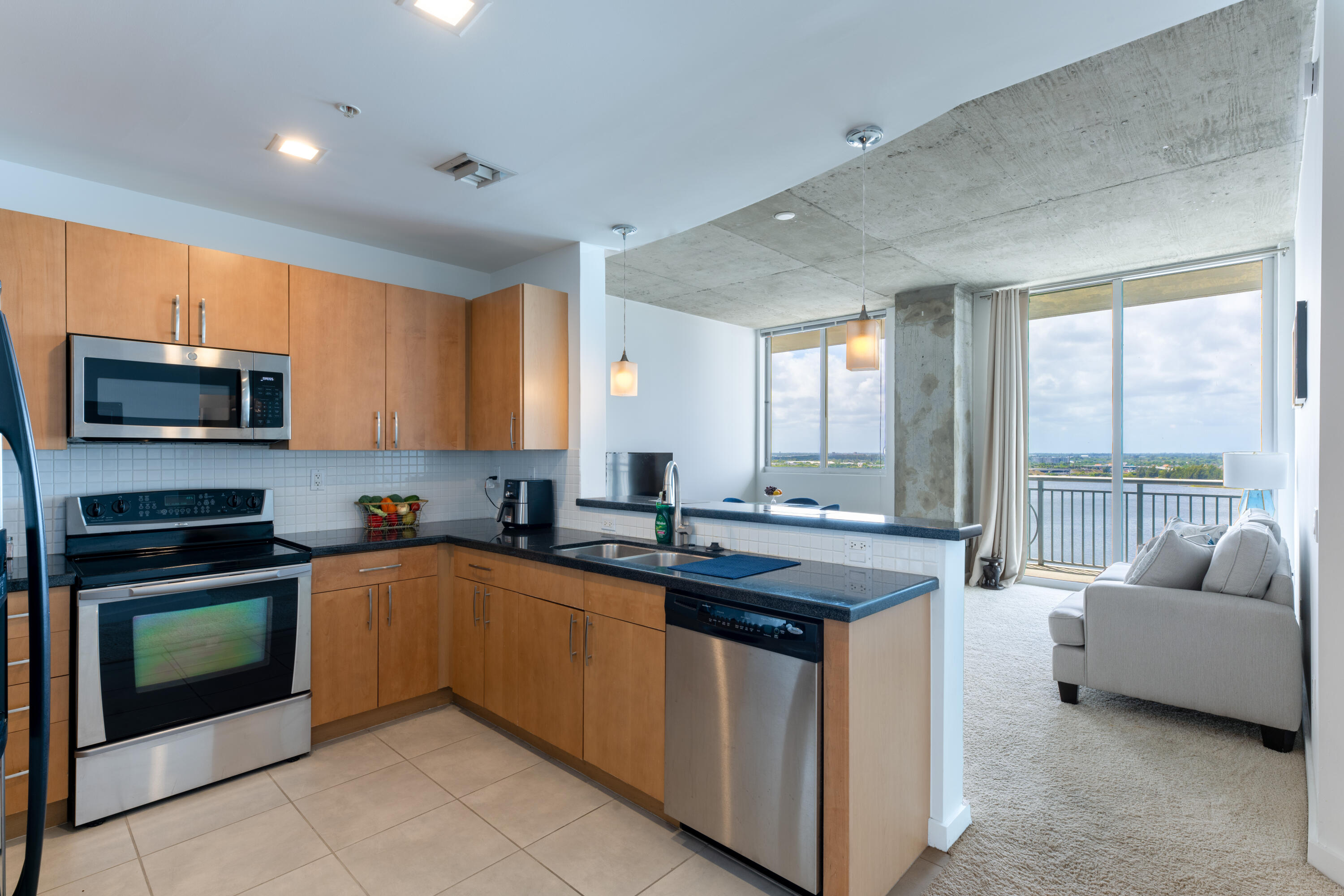 a kitchen with a stove a sink and a refrigerator