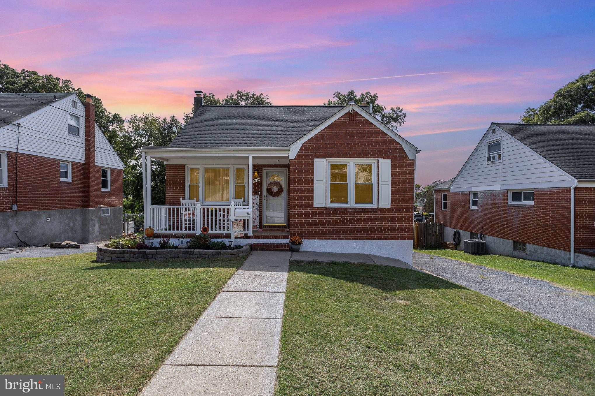 a view of house with yard