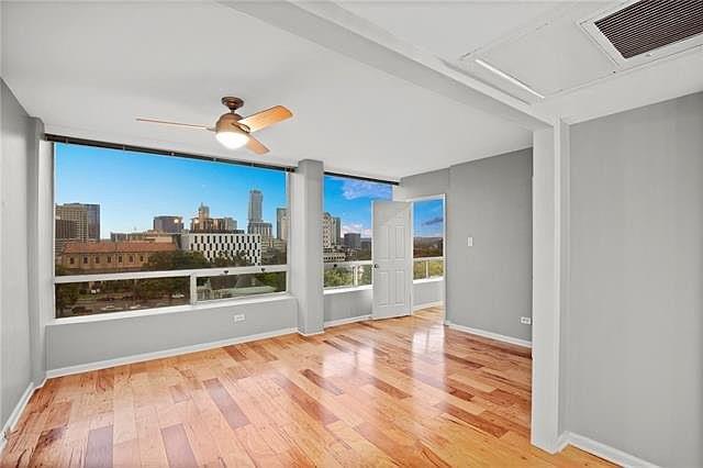 a view of a living room with wooden floor