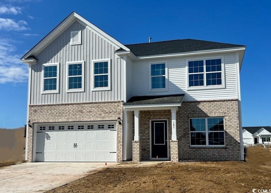 View of front of property featuring a garage