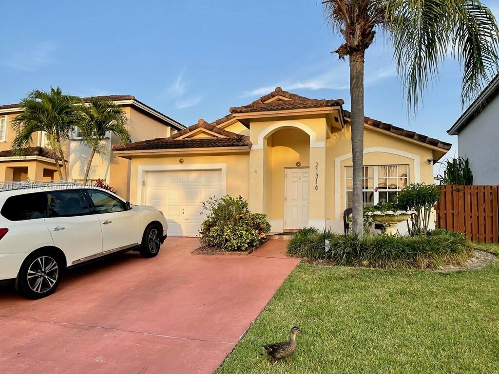 a car parked in front of a house