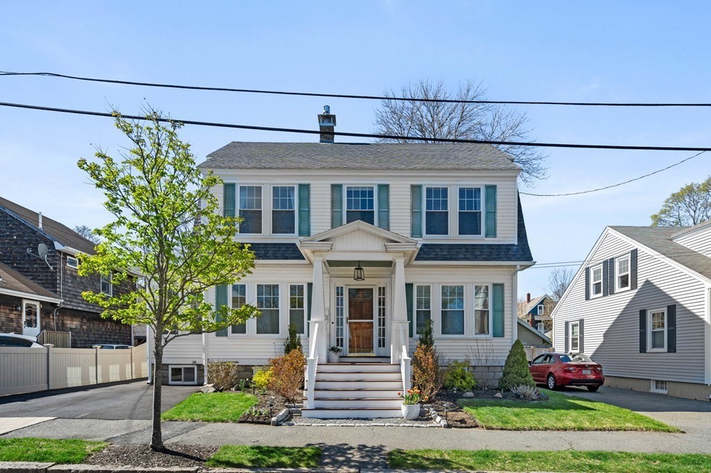 a front view of a house with garden