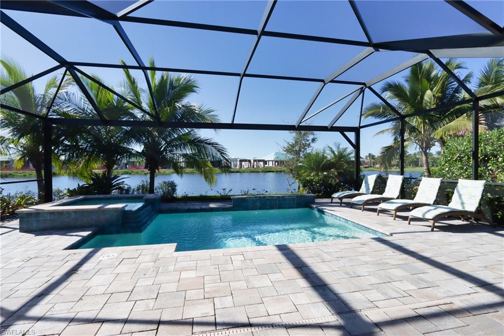 a view of a backyard with sitting area