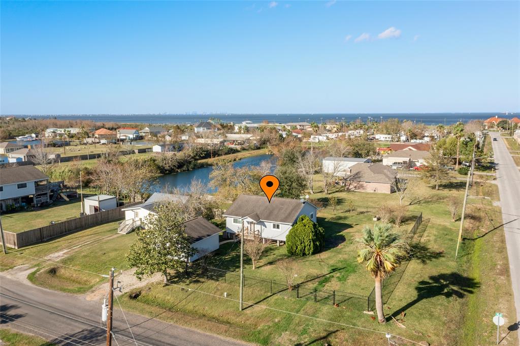 an aerial view of a house with a ocean view