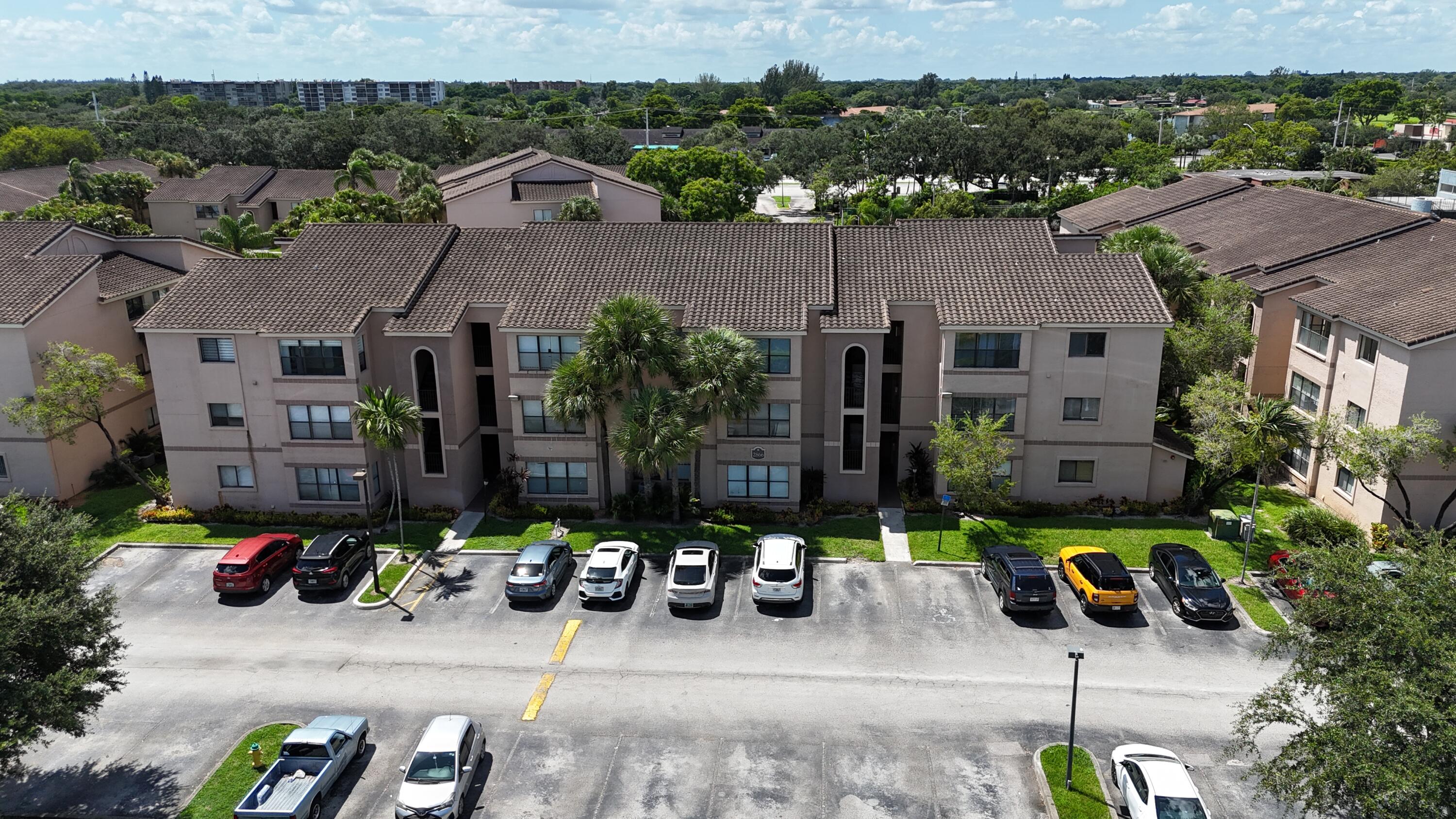 an aerial view of a house with parking space