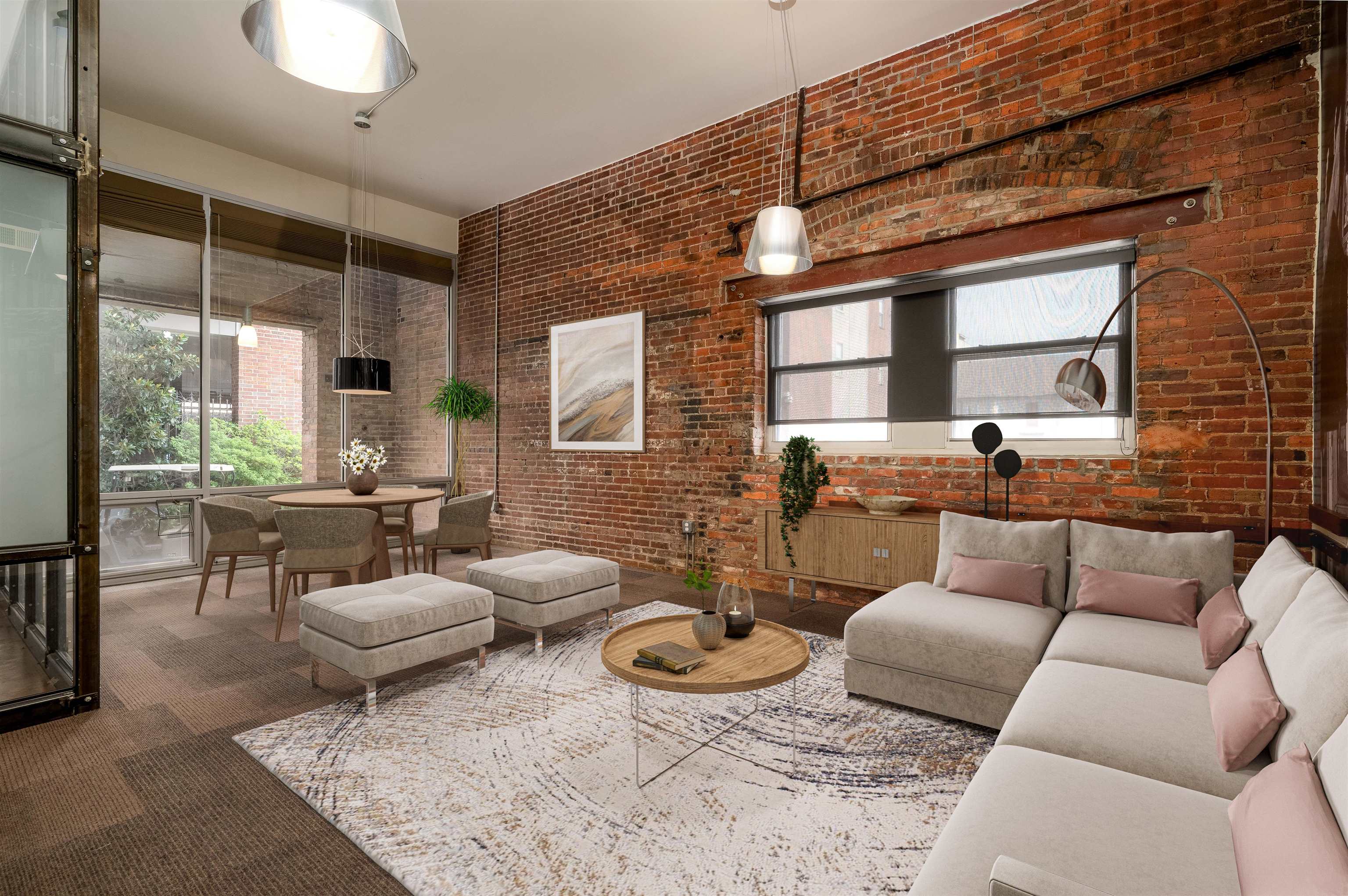 Living room featuring brick wall, a wealth of natural light, and dark carpet