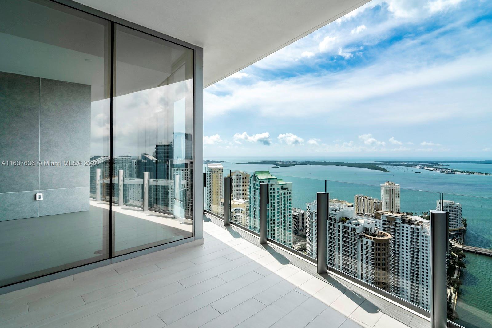 a view of a balcony with floor to ceiling windows yard