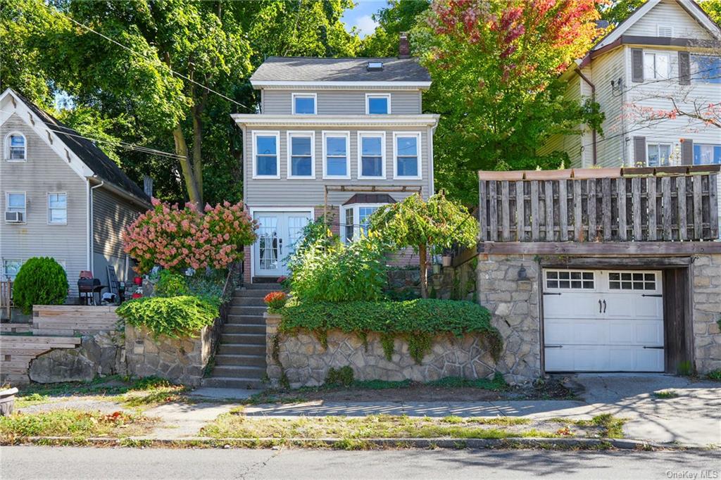 View of front of property with a garage