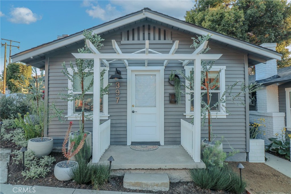 a front view of a house with garden