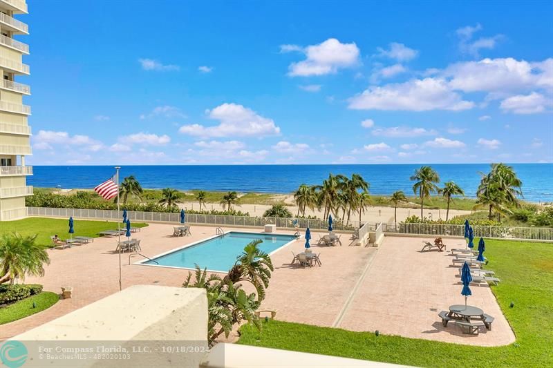 a view of a swimming pool and an outdoor seating