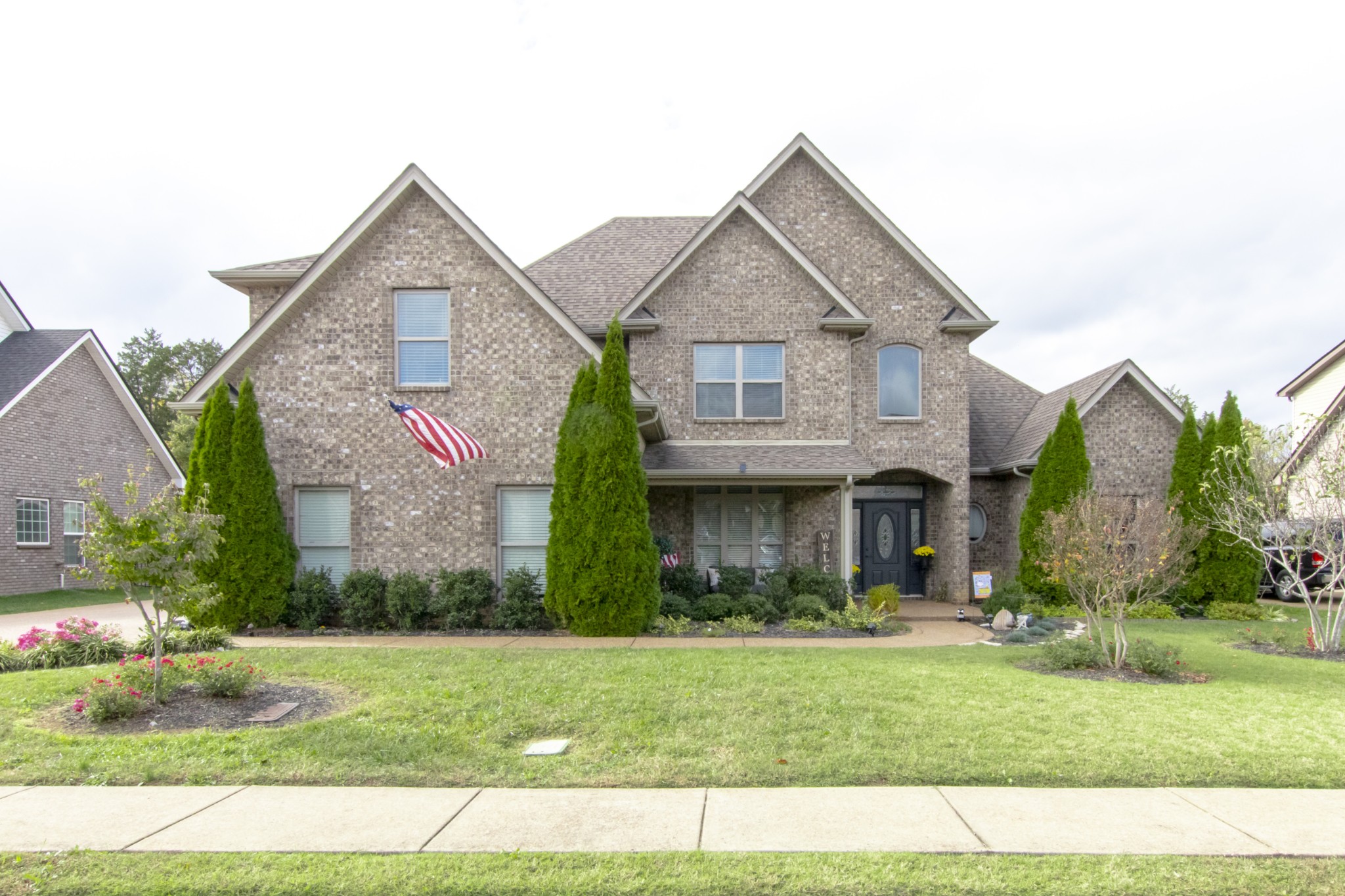 a front view of a house with a yard