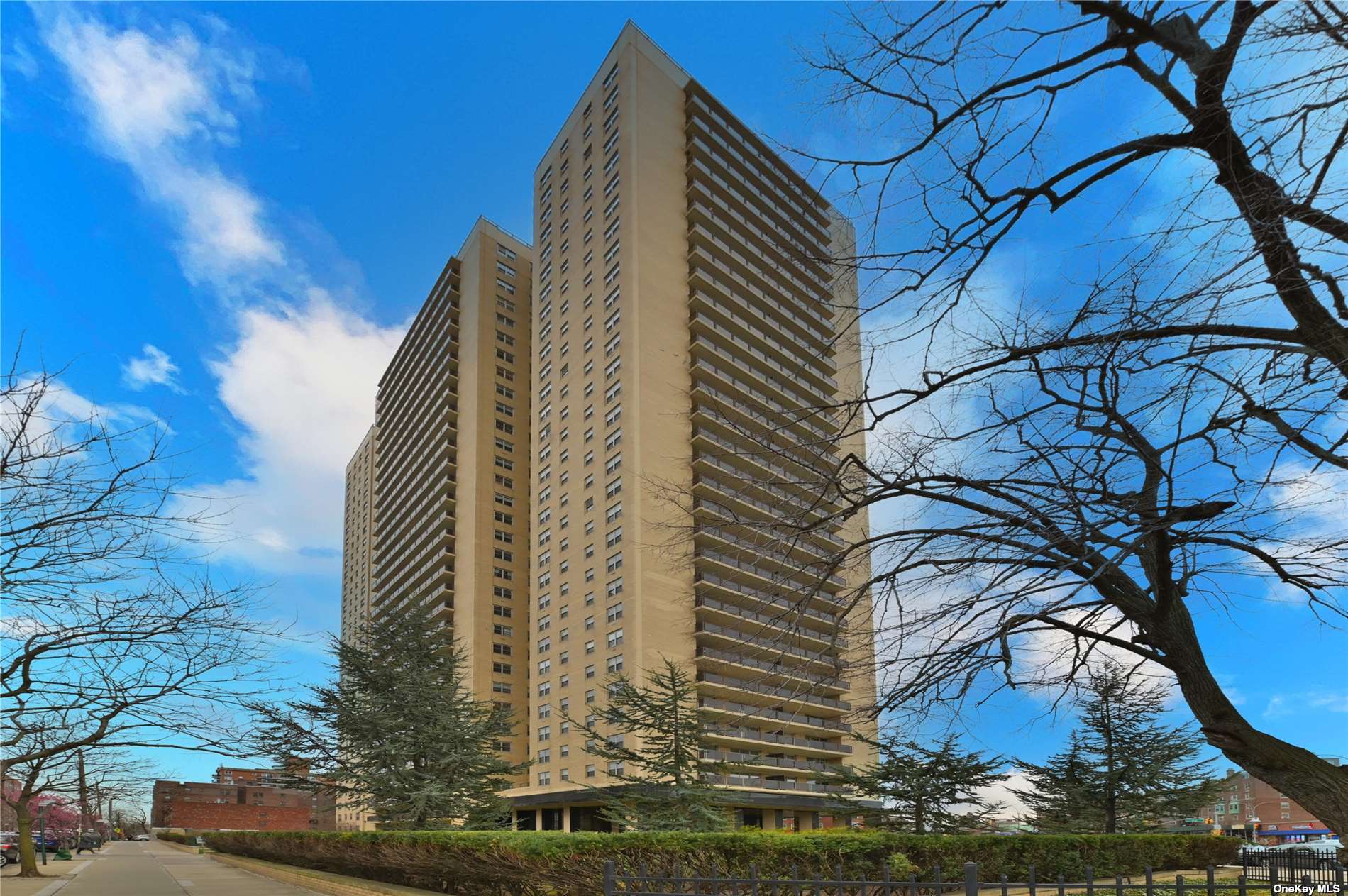 a view of a large building with a tree in the background