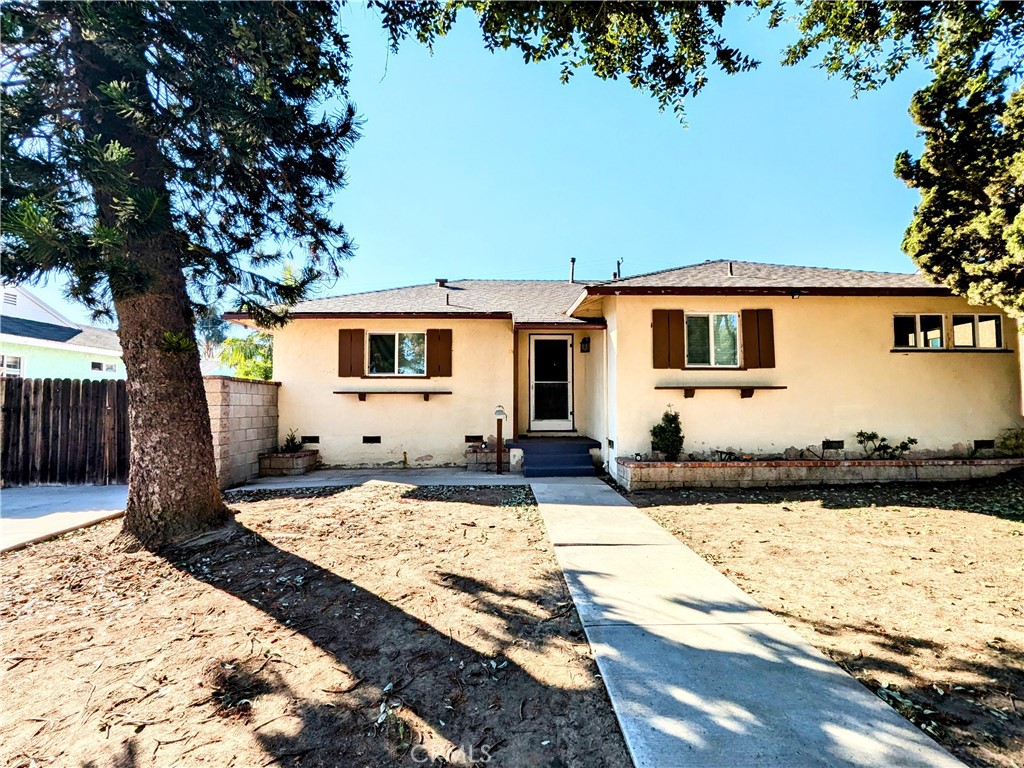 a front view of a house with yard