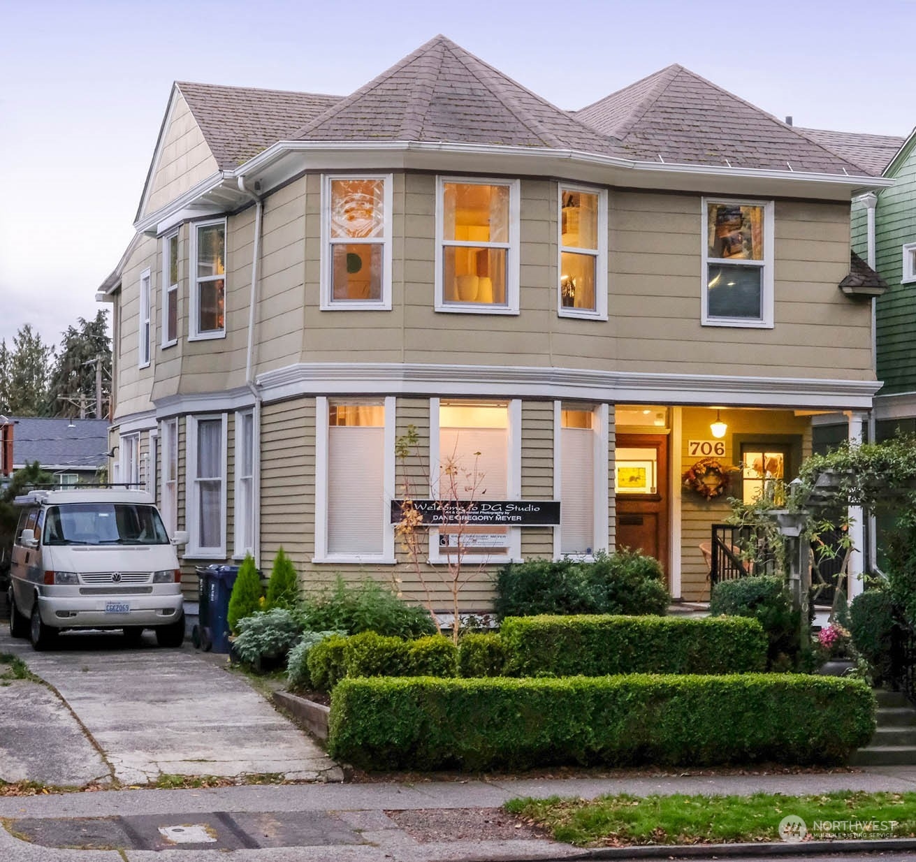 a front view of a house with a garden