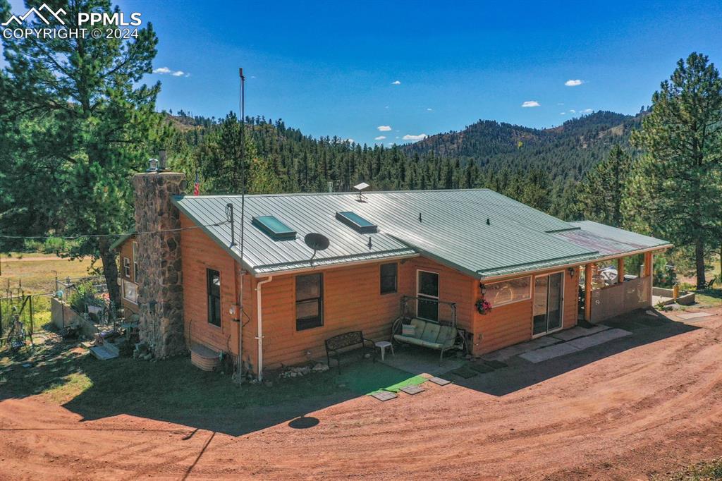 a aerial view of a house with a yard