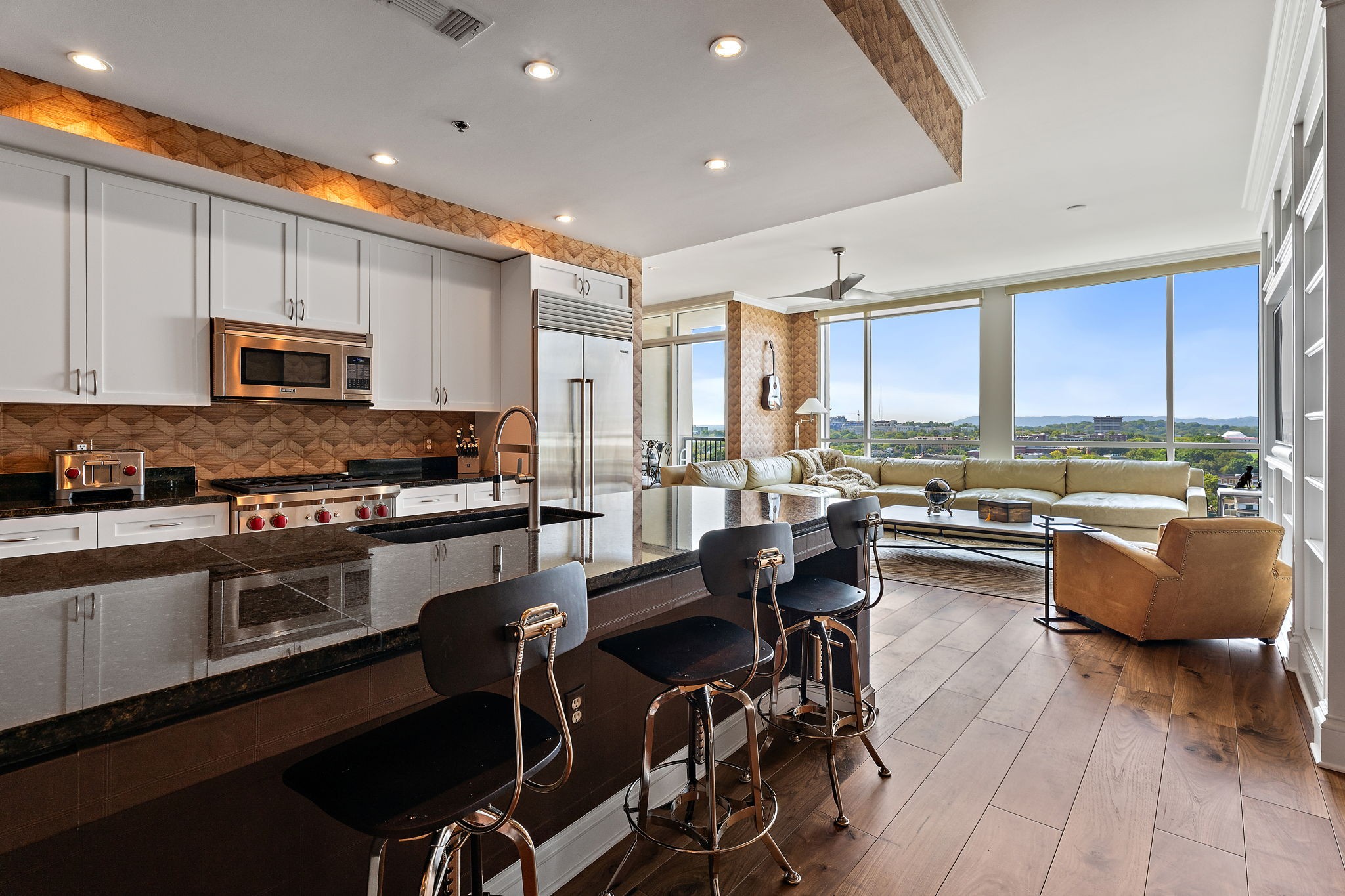 a kitchen with granite countertop lots of counter top space and furniture