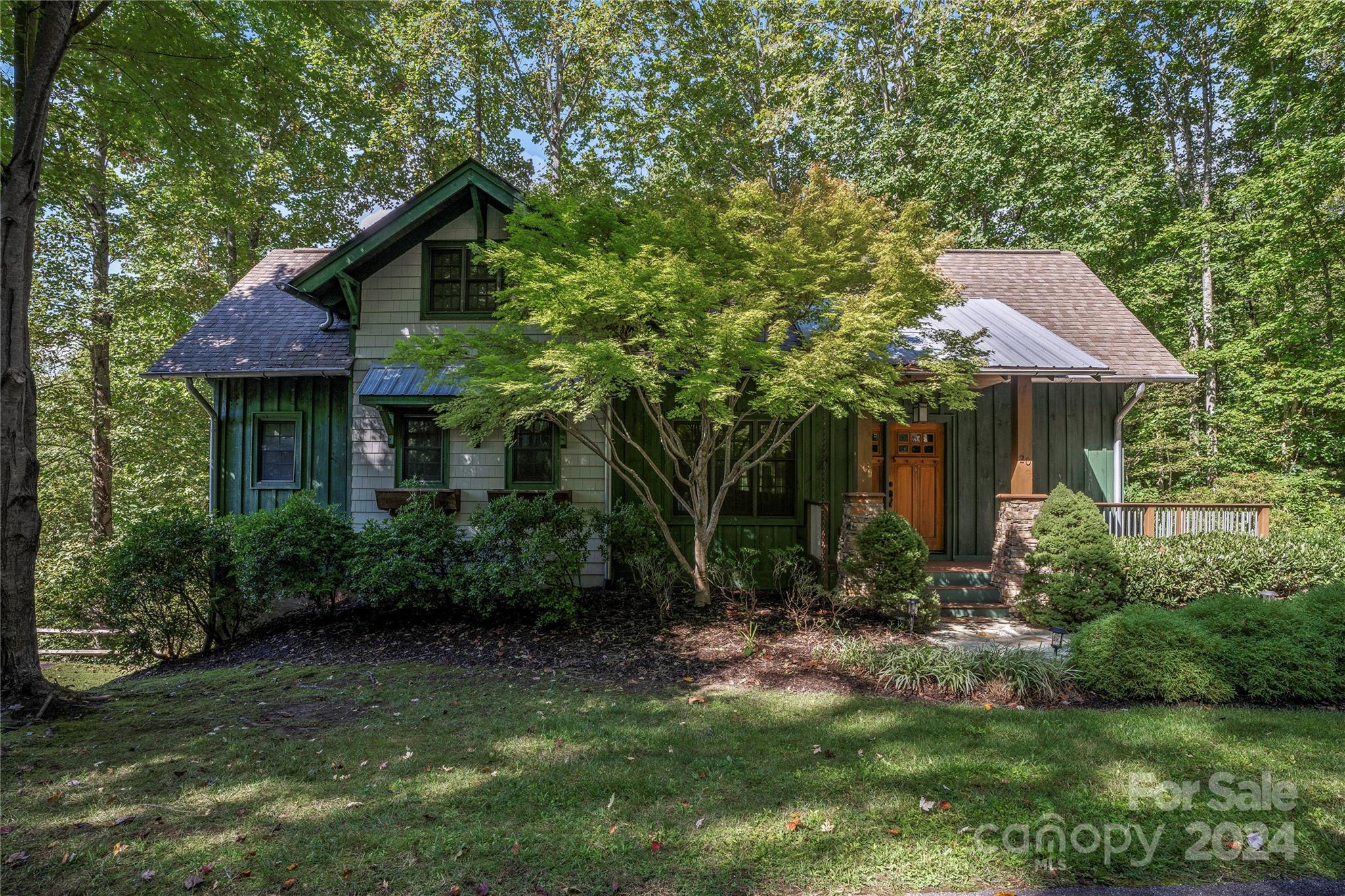 a front view of a house with garden