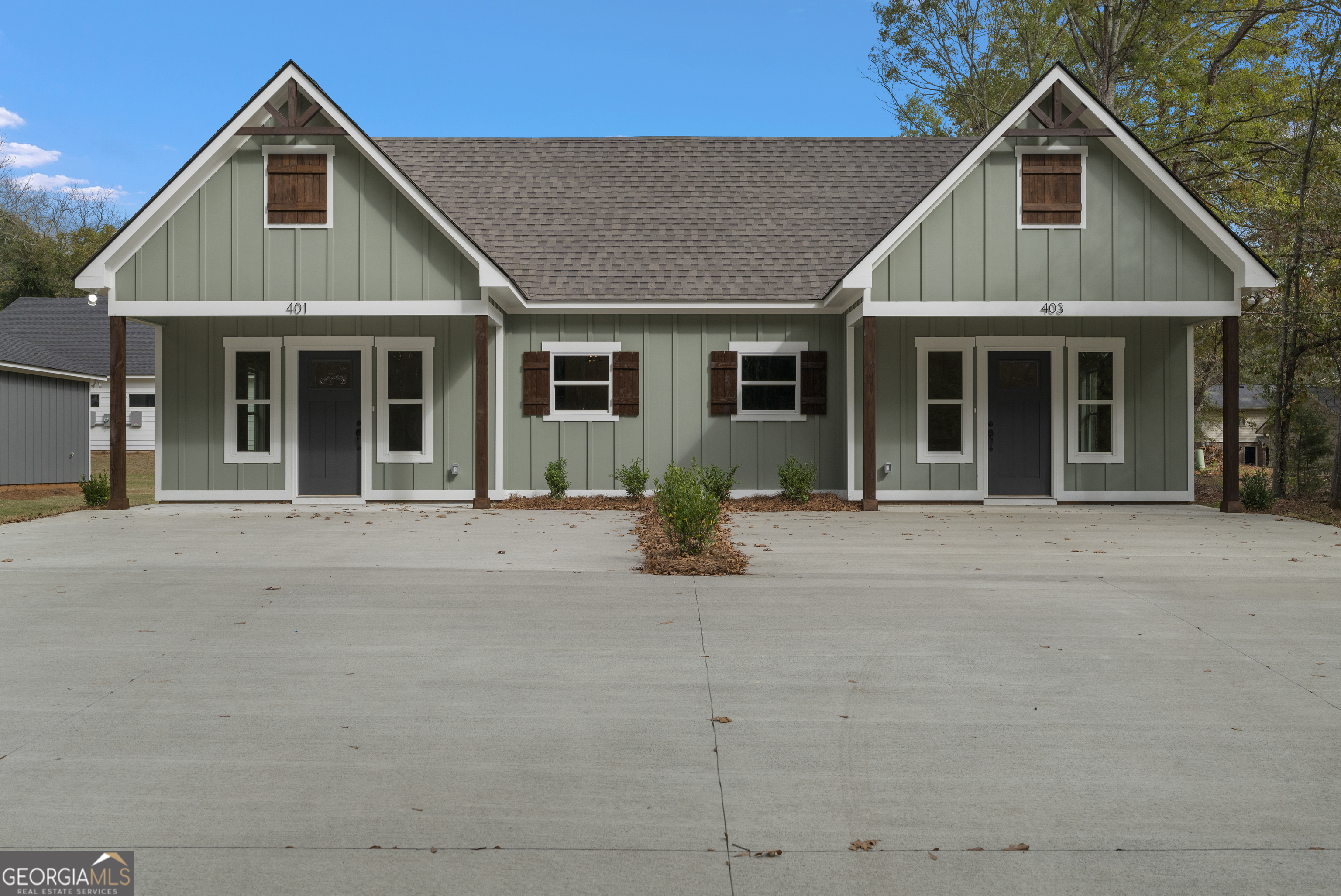 a front view of a house with garage