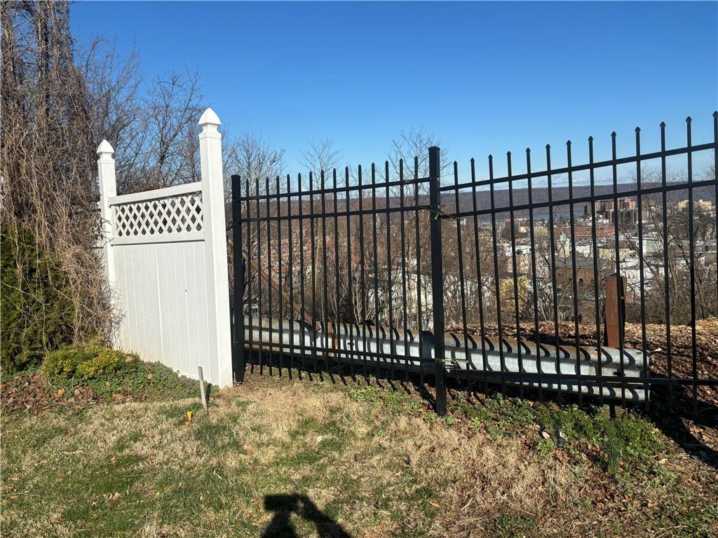 a view of a wrought iron fences in front of house